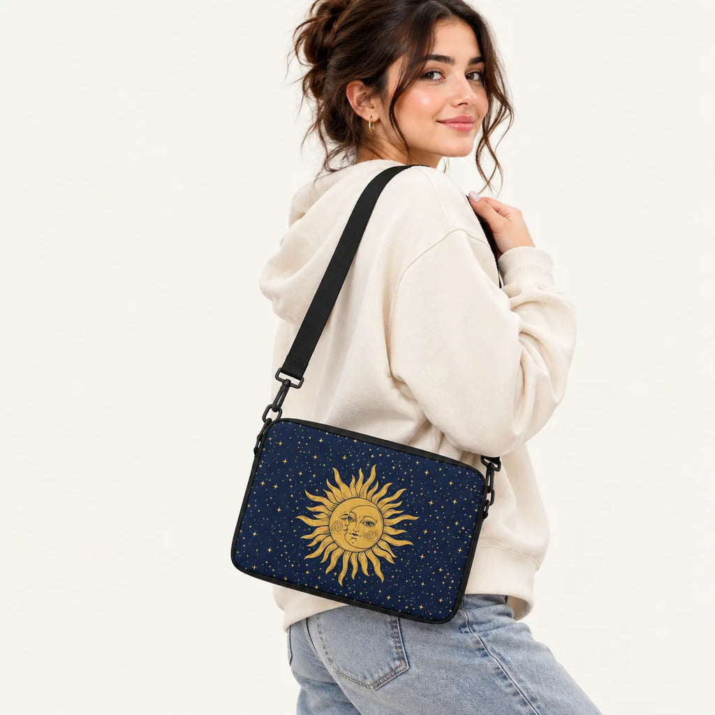 Vintage golden celestial sun and crescent moon design surrounded by stars on a dark navy blue padded laptop sleeve by SLEEVER