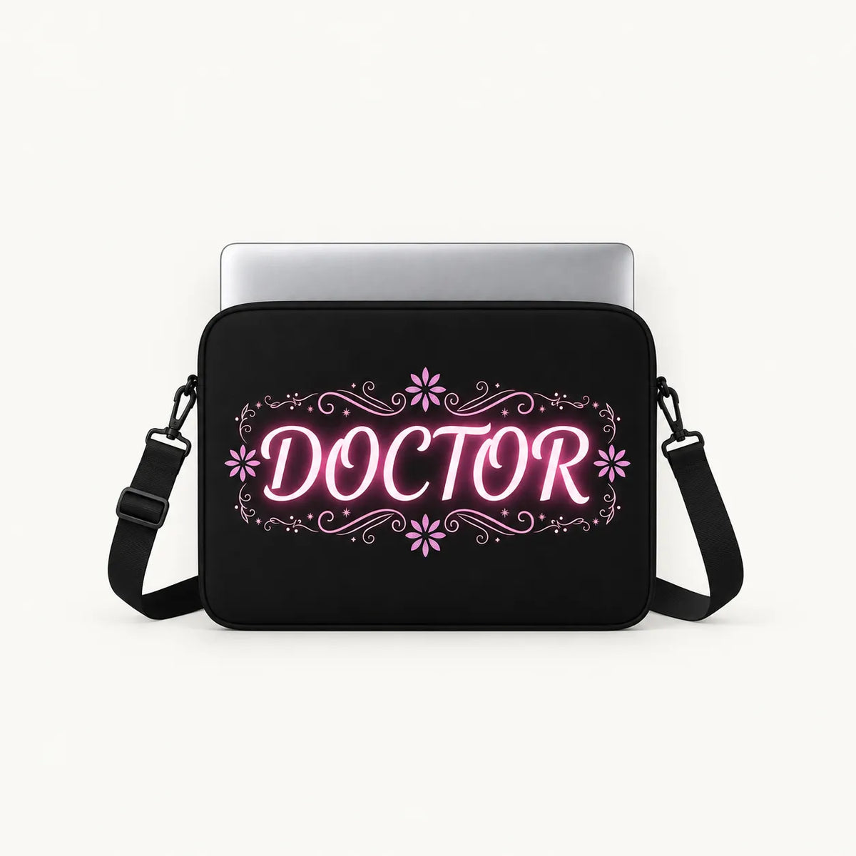 Glowing pink neon DOCTOR typography with floral flourishes on a black padded laptop sleeve by SLEEVER   