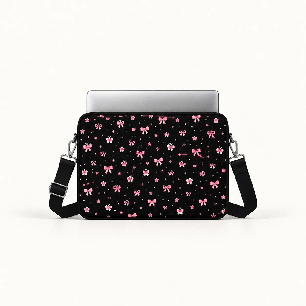 Cute pink ribbon bows, flowers, butterflies, and sparkling stars pattern on a black padded laptop sleeve by SLEEVER