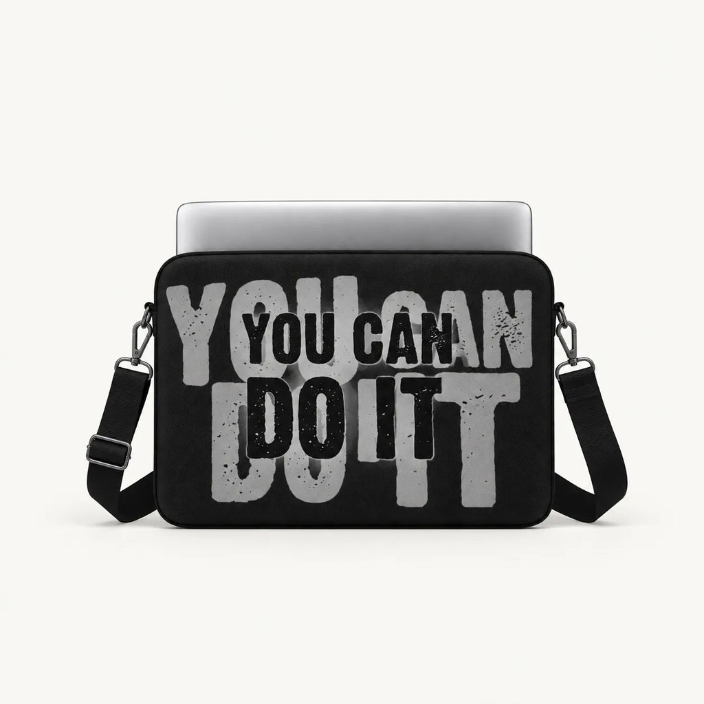 Layered bold textured typography reading You Can Do It in grey and black on a black padded laptop sleeve by SLEEVER