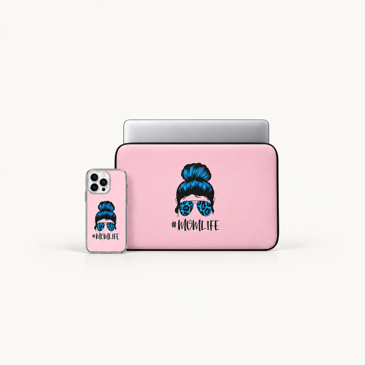 A pink laptop sleeve and matching phone case set with a graphic of a woman with a blue hair bun and sunglasses, and the text '#MOMLIFE' on a clean white background.