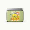 A laptop sleeve featuring a retro-style Tweety Bird graphic on a light green background, shown with a silver laptop partially inserted against a clean white studio background.