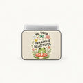 Cute green frog sitting on a red toadstool surrounded by flowers and Be Your Own Kind of Beautiful typography on cream padded laptop sleeve by SLEEVER