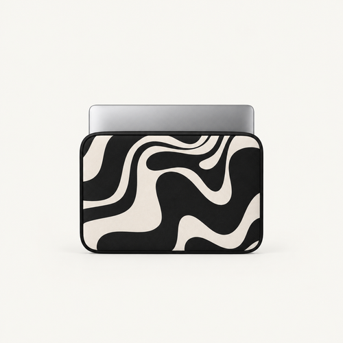 A laptop sleeve with a bold black and cream wavy abstract pattern, shown with a silver laptop partially inserted, on a clean off-white background.