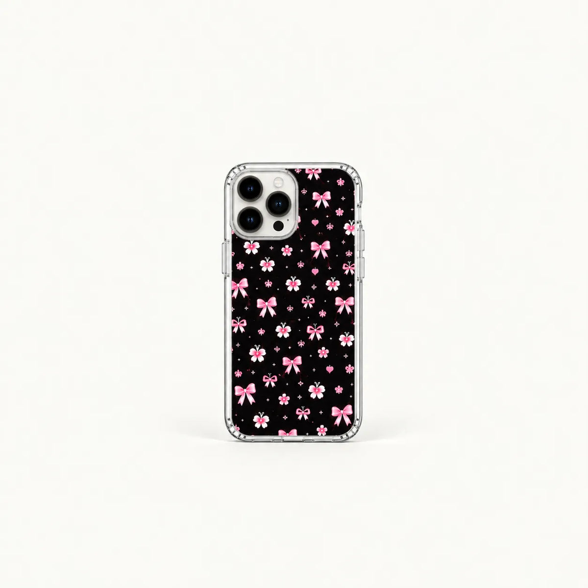 SLEEVER clear TPU phone case with pink ribbon bows, flowers, and tiny hearts pattern on black background UV print with magnetic charging compatibility