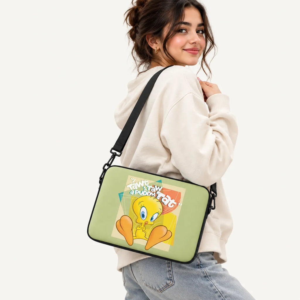 Tweety Bird character illustration with I Tawt I Taw A Puddy Tat text on a sage green padded laptop sleeve by SLEEVER