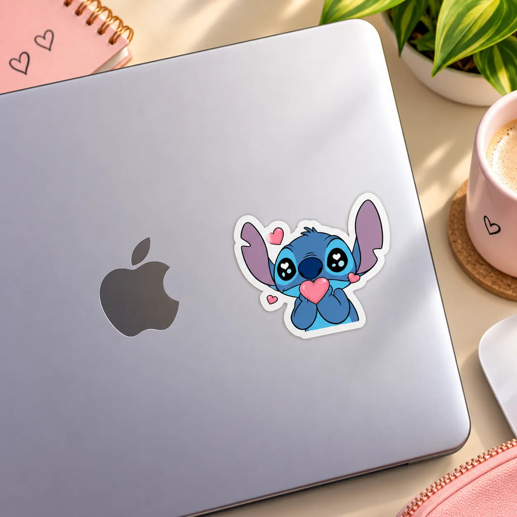 Cute blue Disney Stitch holding a pink heart with heart eyes sticker by SLEEVER