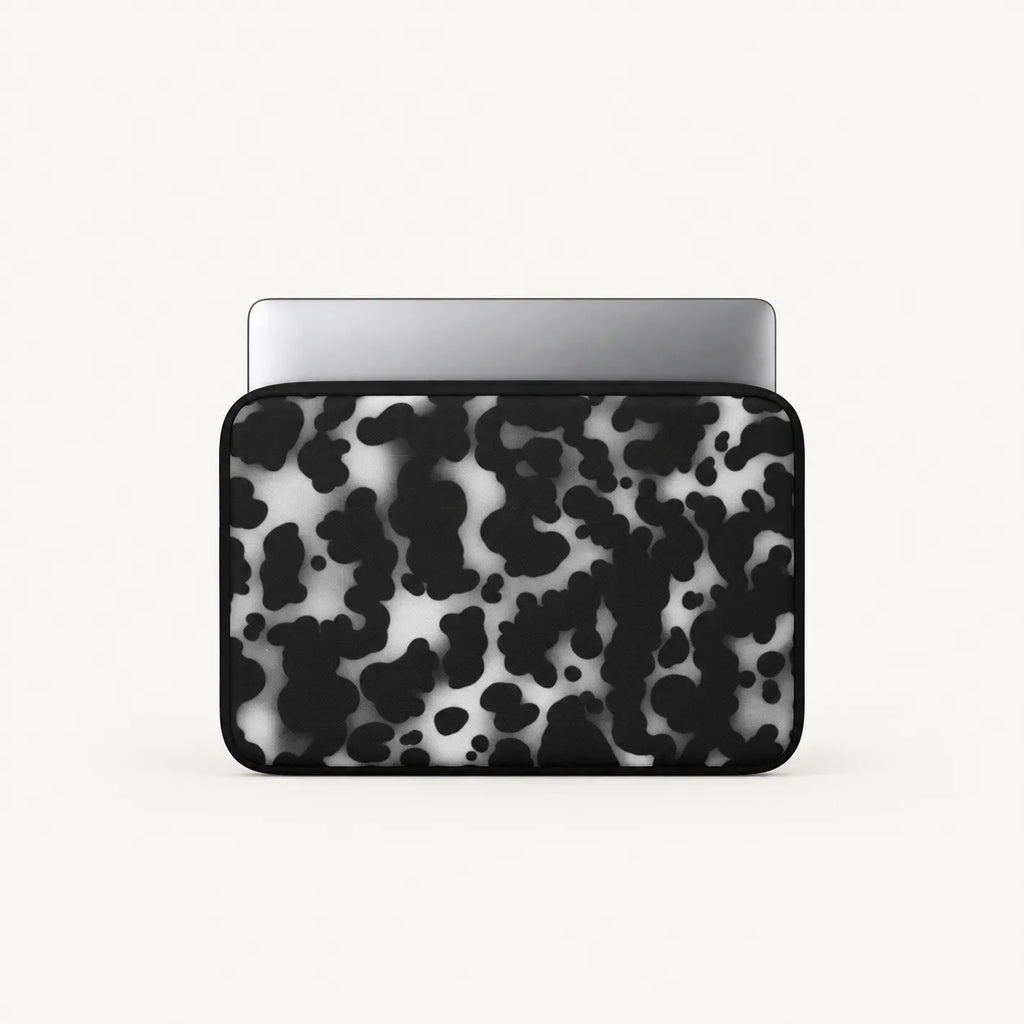 Monochrome black and white dalmatian spot print padded laptop sleeve by SLEEVER