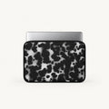 Monochrome black and white dalmatian spot print padded laptop sleeve by SLEEVER
