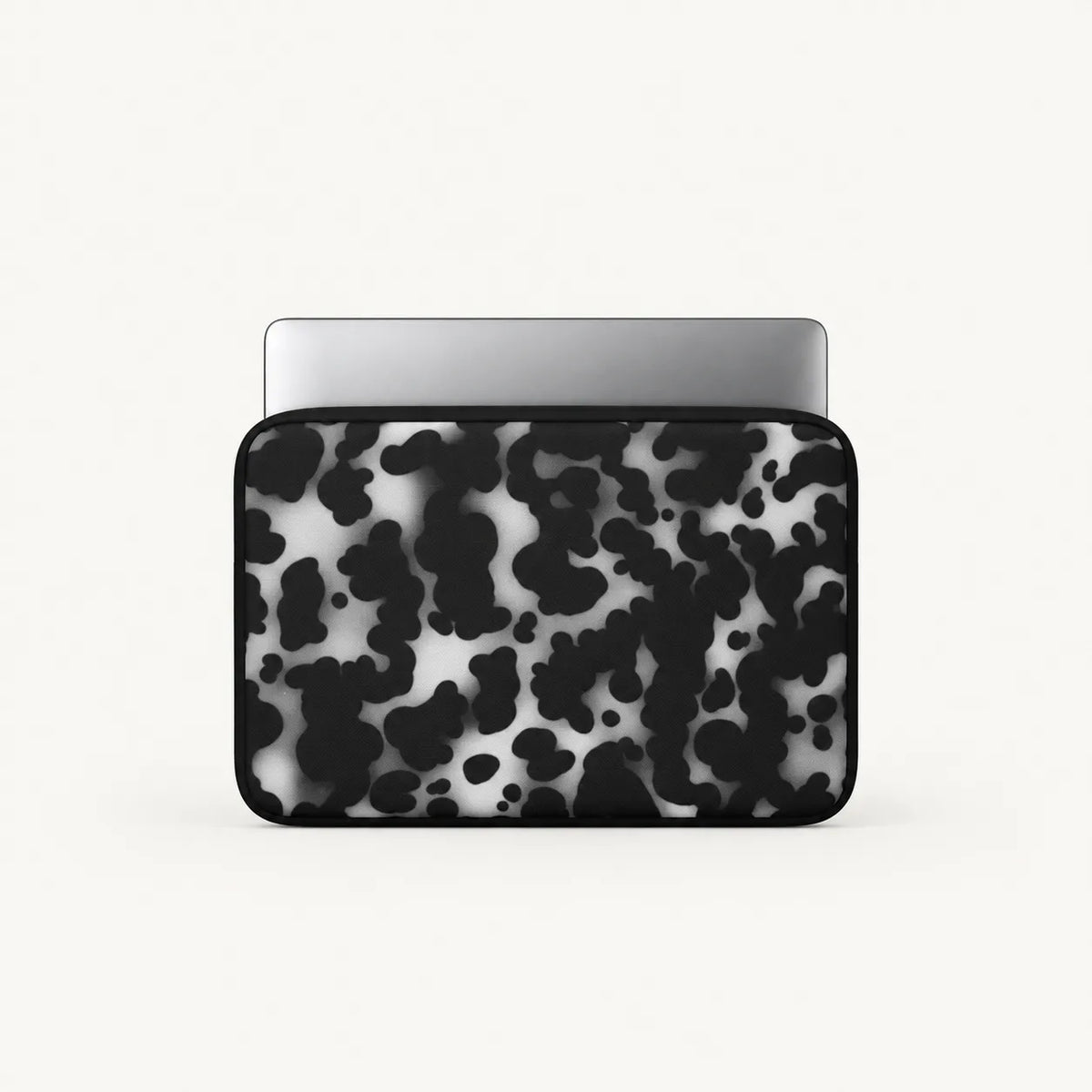 Monochrome black and white dalmatian spot print padded laptop sleeve by SLEEVER