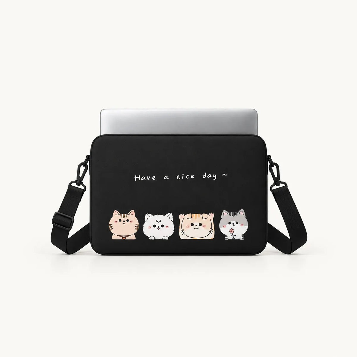 Four cute cartoon cats with Have a nice day typography on a black padded laptop sleeve by SLEEVER